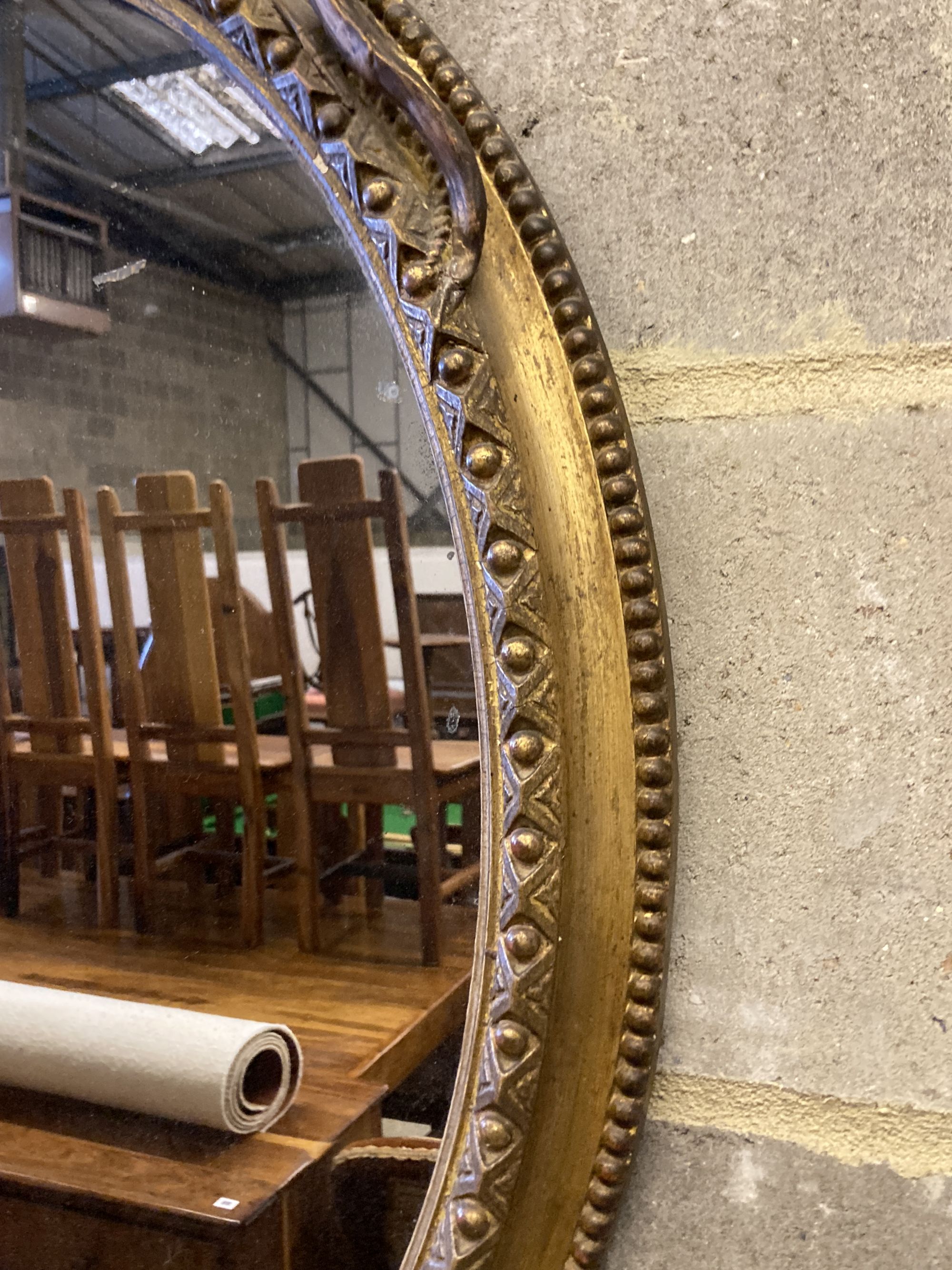 A Victorian giltwood and composition oval wall mirror, width 56cm, height 88cm